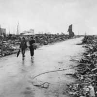 In this Sept. 8, 1945, file photo released by the U.S. Air Force, two people are seen walking on a path through the destruction that resulted from the Aug. 6 atomic bombing of Hiroshima. | U.S. AIR FORCE VIA AP