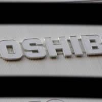 Toshiba posted a net loss of ¥11.35 billion for the April-June quarter, as the coronavirus fallout hurt the business.   | REUTERS