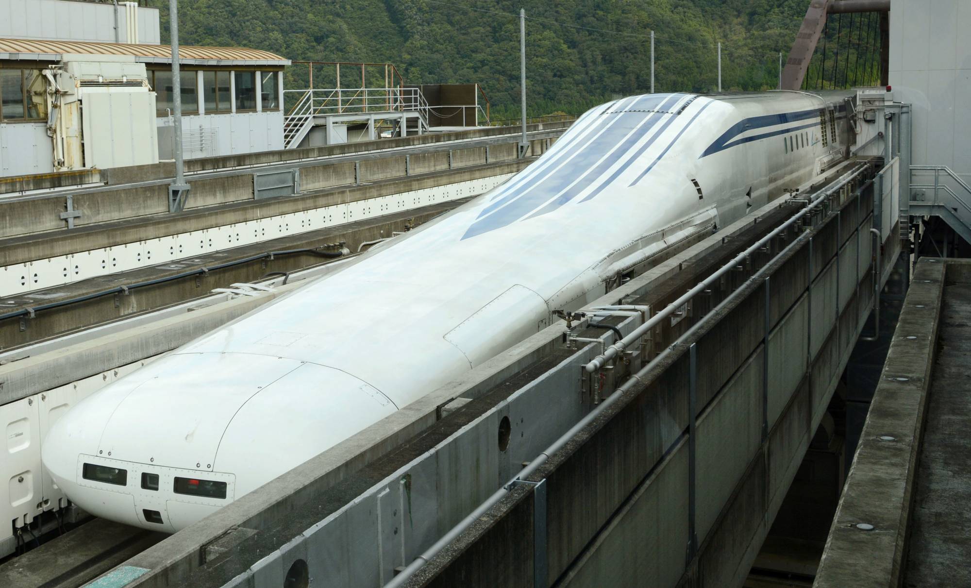 A prototype of a Central Japan Railway Co. maglev train is unveiled to the media at an experimental center in Yamanashi Prefecture on Oct. 3, 2019. | KYODO