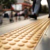 Tactile paving allows people with visual impairments to navigate Japan\'s congested footpaths and train stations. | GETTY IMAGES