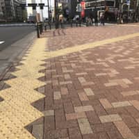 Tactile paving at an intersection in Tokyo.  | KATHRYN WORTLEY
