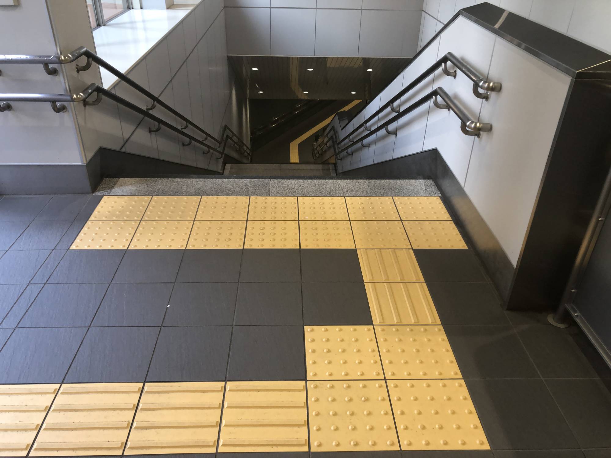 Tactile paving can guide a visually impaired person to the top of a flight of stairs at a train station in Tokyo. | KATHRYN WORTLEY 
