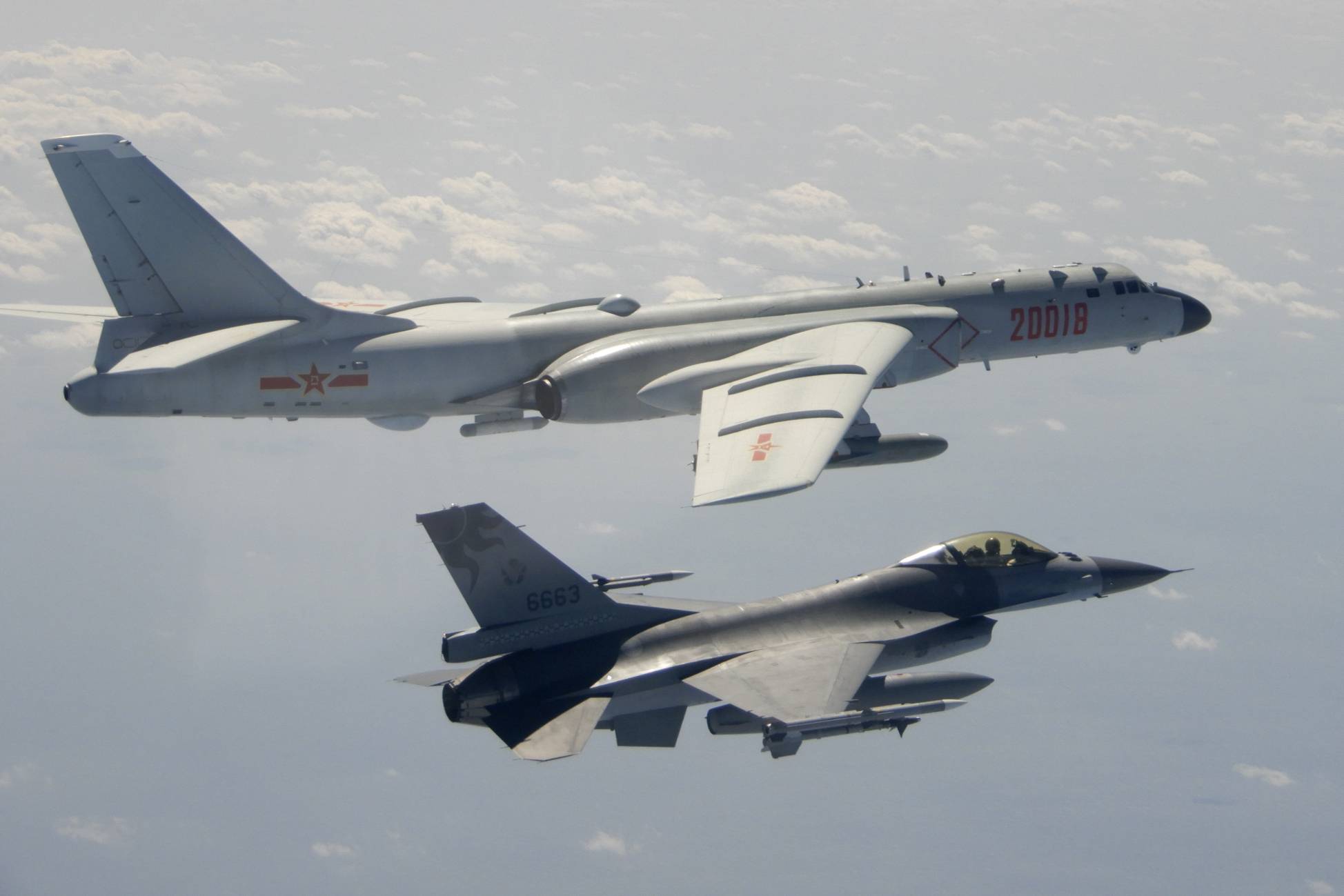 A Taiwanese Air Force F-16 in the foreground flies on the flank of a Chinese People's Liberation Army Air Force H-6 bomber as it passes near Taiwan in February.  | REPUBLIC OF CHINA MINISTRY OF NATIONAL DEFENSE / VIA AP
