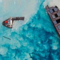 The MV Wakashio bulk carrier ran aground and broke into two parts near Blue Bay Marine Park off the coast of Mauritius. | AFP-JIJI