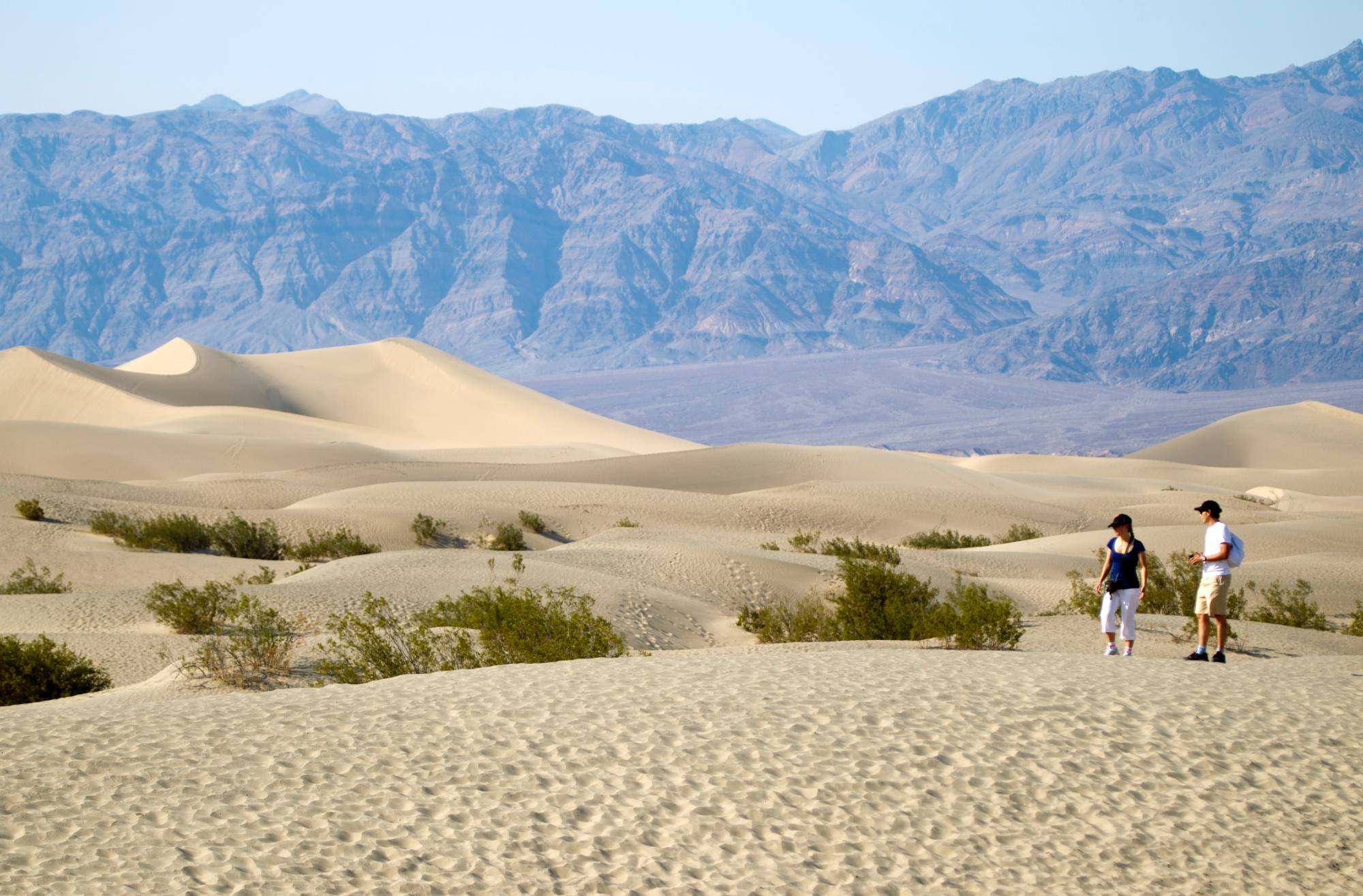 Visitors walk in the Mesquite Dunes in Death Valley National Park, California, in late July.  | REUTERS 
