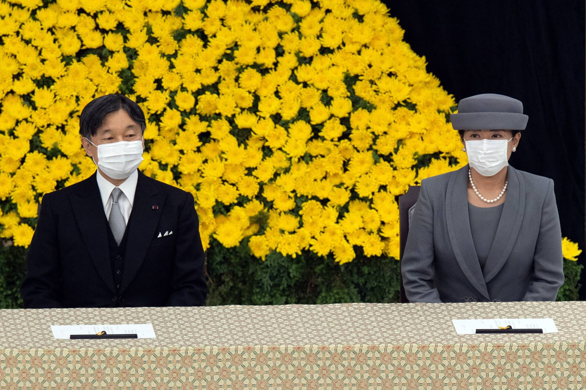 Emperor Naruhito and Empress Masako attend a memorial service marking the 75th anniversary of Japan's surrender in World War II at the Nippon Budokan hall on Aug. 15. | POOL / VIA REUTERS