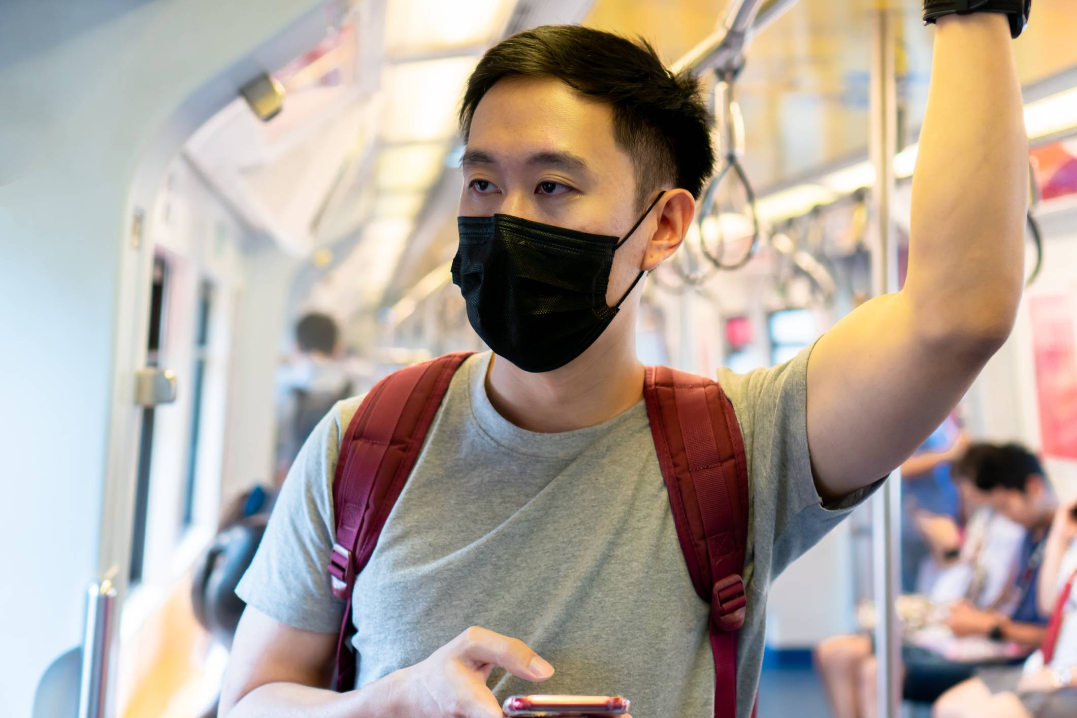 Blending in: A man wears a mask on the train amid the COVID-19 pandemic. According to a survey, Japanese people were more likely to wear a face mask to fit in rather than protect other people from the virus.  | GETTY IMAGES