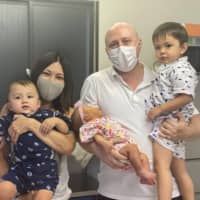 Caring clan: Geoff and Chikako Morris pose with their three children. Geoff moved to Japan 13 years ago and now runs Oyako Cafe and Natural English in Osaka\'s Nishinakajima neighborhood.  | H.J. MILON
