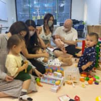 Play break: Geoff and Chikako Morris provide a place for kids to play around and moms to get some things off their chests.  | H.J. MILON
