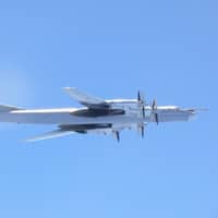 A Russian TU-95 bomber is seen flying near the southern part of Japan in this handout picture taken by the Air Self-Defense Force in  August 2017. | JOINT STAFF OFFICE OF THE DEFENSE MINISTRY OF JAPAN / VIA REUTERS