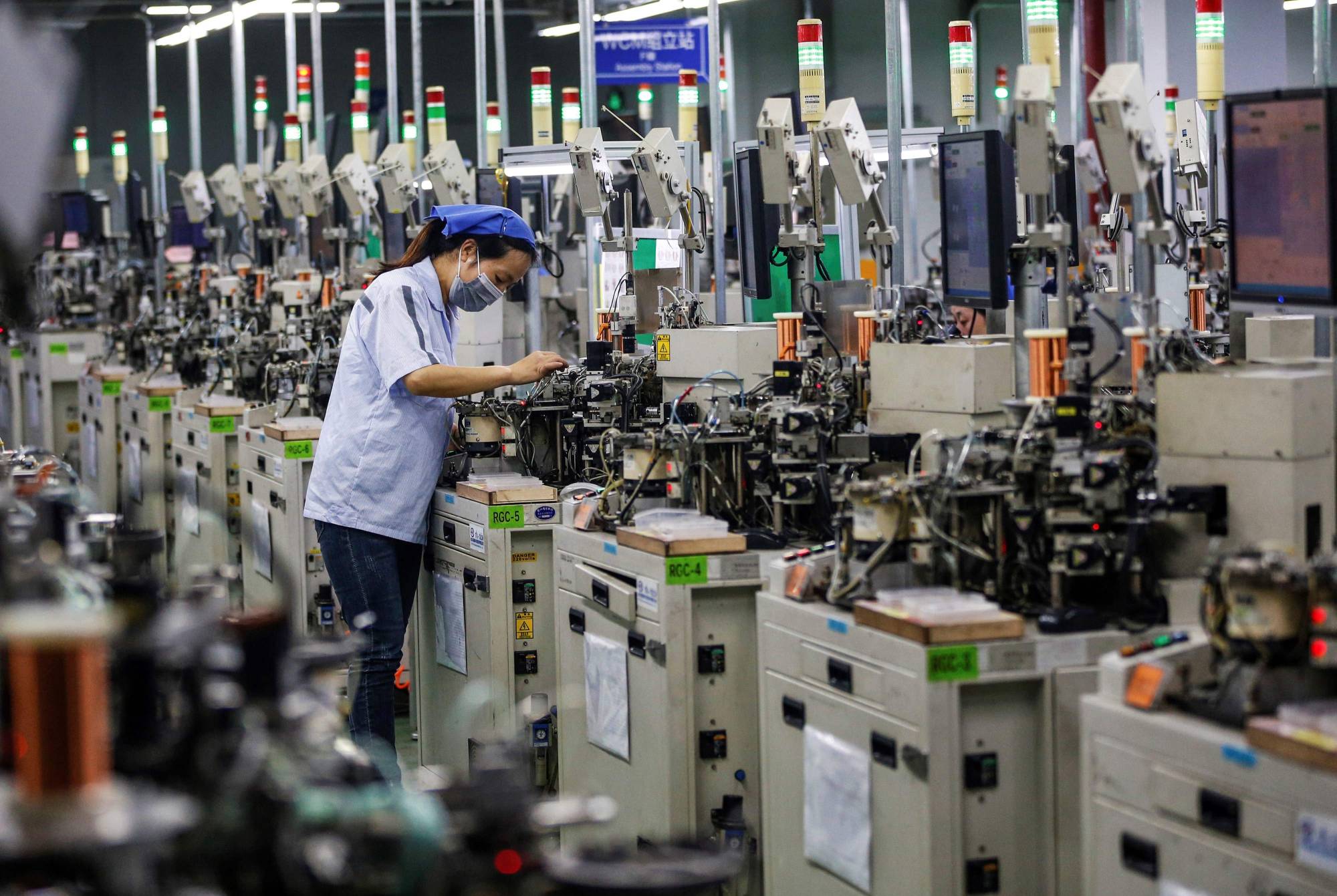 Countries like Japan cannot afford to ignore the rise of China as a manufacturing power. | STR / VIA AFP-JIJI