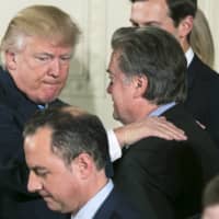 U.S. President Donald Trump congratulates Steve Bannon, his chief strategist, at a swearing-in ceremony at the White House in Washington in January 2017.  | AL DRAGO/THE NEW YORK TIMES