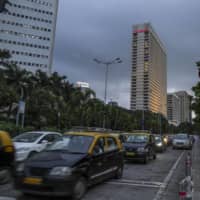 Vehicles sit in traffic in Mumbai last September. | BLOOMBERG