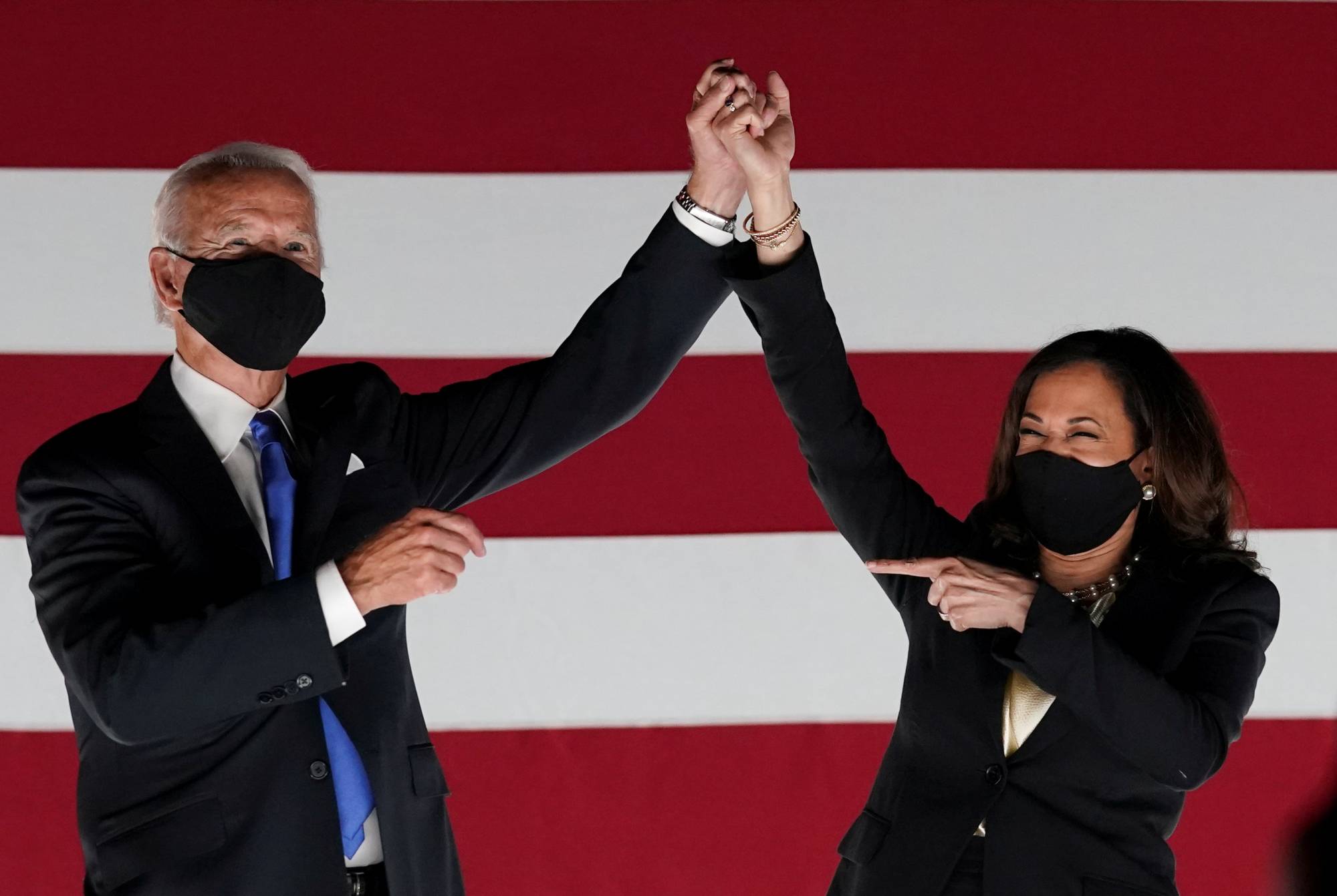 Democratic presidential candidate Joe Biden and and his running mate, Sen. Kamala Harris, celebrate after Biden accepted the 2020 Democratic presidential nomination at the party convention in Wilmington, Delaware, on Thursday. | REUTERS