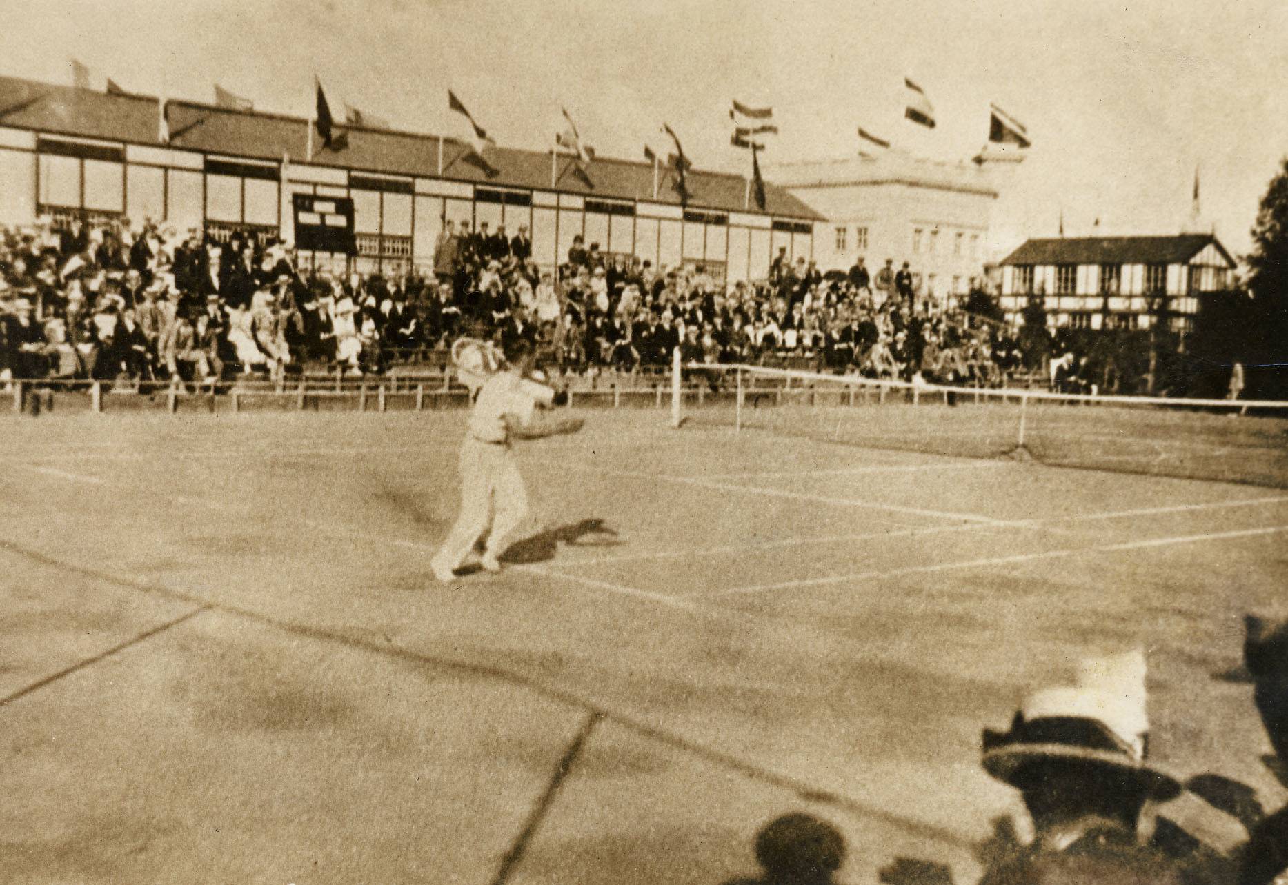 Ichiya Kumagai (front) competes in the men's singles tennis tournament at the 1920 Olympics in Antwerp, Belgium. | JAPAN TENNIS ASSOCIATION / VIA KYODO