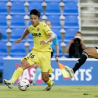 Takefusa Kubo (left) competes for Villarreal during a friendly on Sunday in San Pedro de Pinatar, Spain. | KYODO