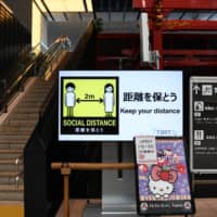 While the signs at the airport look friendly enough, non-Japanese residents are finding it difficult, in some cases impossible, to return to their homes in Japan. | BLOOMBERG