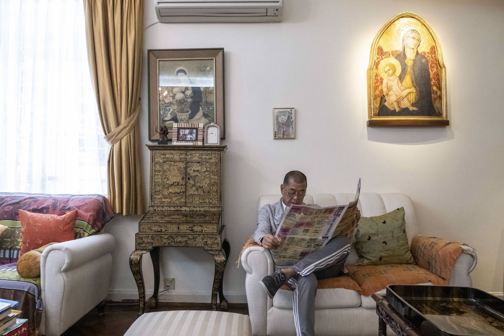 Jimmy Lai sits at his home in Hong Kong a few days after he was arrested by police under the city's new national security law. | LAM YIK FEI/THE NEW YORK TIMES
