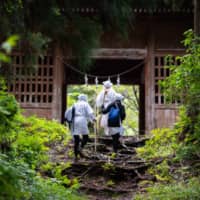 Back to basics: People participate in a training program for mountain ascetic hermits in Yamagata Prefecture. | COURTESY OF DEREK YAMASHITA
