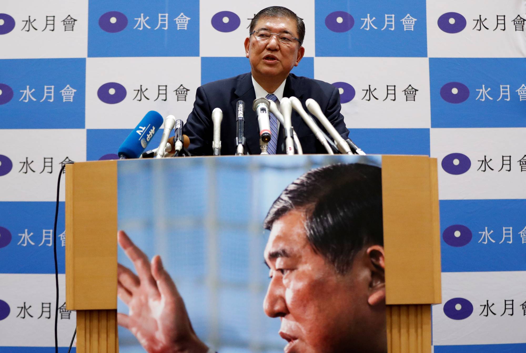 Former Defence Minister Shigeru Ishiba gives a news conference to announce his participation in the LDP leadership election to choose the successor to Prime Minister Shinzo Abe in Tokyo on Tuesday. | REUTERS