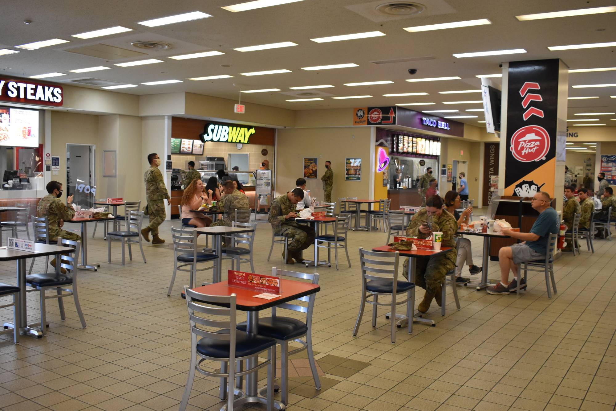 Tables in the food court area have been spaced out, with visitors required to keep masks on except when they are eating. | TOMOHIRO OSAKI