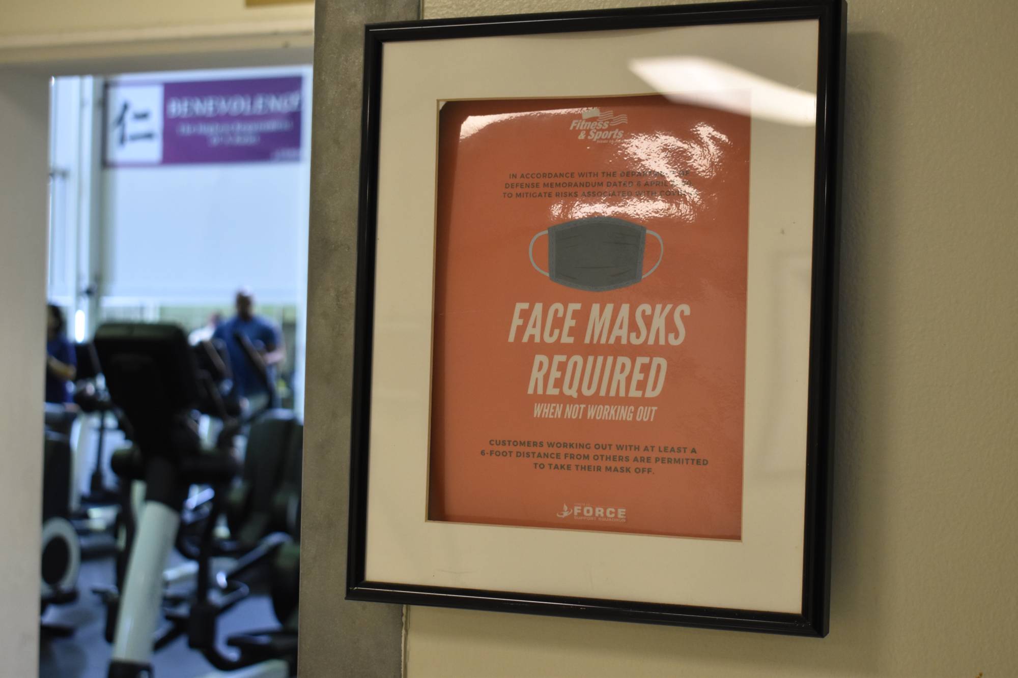 Some treadmills have been marked as unavailable at the Samurai Fitness Center, where hand sanitizers and reminders of mask-wearing policies are omnipresent. | TOMOHIRO OSAKI 