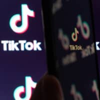 SoftBank Group Corp. is exploring assembling a group of bidders for TikTok’s India assets, according to sources. | BLOOMBERG