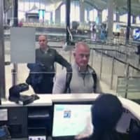 Security camera video shows Michael Taylor, center, and George-Antoine Zayek at passport control at Istanbul Airport on Dec. 30, 2019, as part of the operation to bring Carlos Ghosn to Lebanon.  | DHA / VIA AP