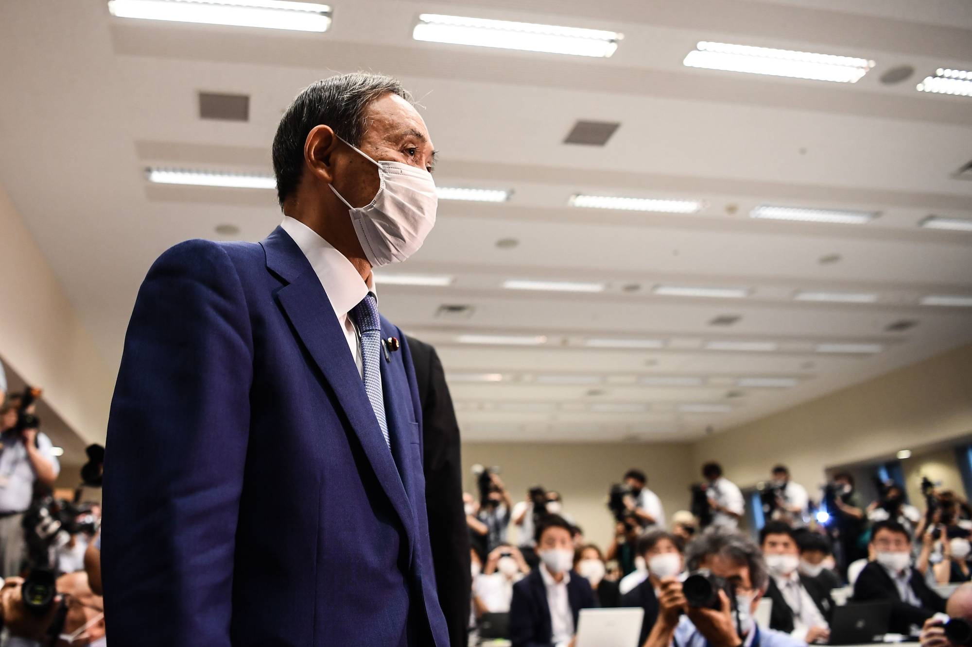 Chief Cabinet Secretary Yoshihide Suga attends a news conference to announce his candidacy for the Liberal Democratic Party leadership in Tokyo on Wednesday. | AFP-JIJI