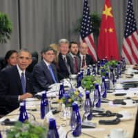 Then-U.S. Vice President Joe Biden (left) and then-President Barack Obama attend a bilateral meeting with Xi Jinping, China\'s president, at the Nuclear Security Summit in Washington in 2016. | POOL / VIA BLOOMBERG