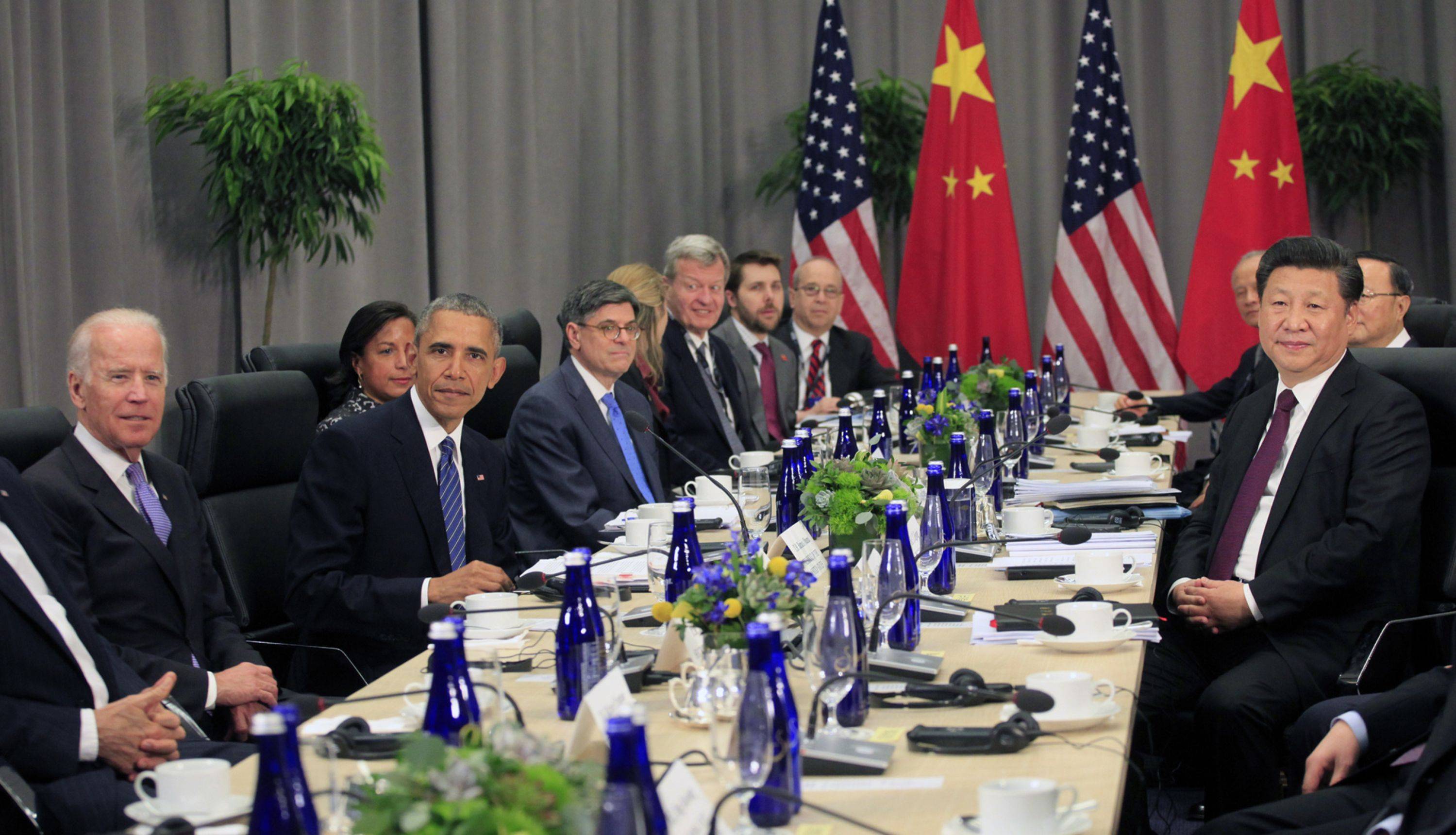 Then-U.S. Vice President Joe Biden (left) and then-President Barack Obama attend a bilateral meeting with Xi Jinping, China's president, at the Nuclear Security Summit in Washington in 2016. | Pool / via Bloomberg