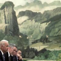 Then-U.S. Vice President Joe Biden speaks during a meeting with China\'s then-president, Hu Jintao, at the Great Hall of the People in Beijing in 2011. | POOL / VIA REUTERS