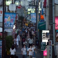 A shopping area in the Setagaya district of Tokyo. The Cabinet Office has rated the economy as \"worsening\" for the 12th straight month.  | BLOOMBERG 