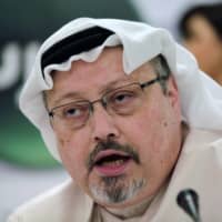 Jamal Khashoggi speaks during a news conference in Manama, Bahrain, in 2014.  | AP