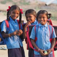 Indian girls smile in 2018 in southern India where ACE works to resolve child labor issues. | © NATSUKI YASUDA / DIALOGUE FOR PEOPLE