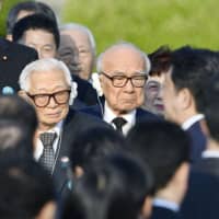 Mikiso Iwasa (left) attends an event at the Peace Memorial Park in Hiroshima in May 2016 along with Barack Obama (right), who visited the city as the first sitting U.S. president. | KYODO