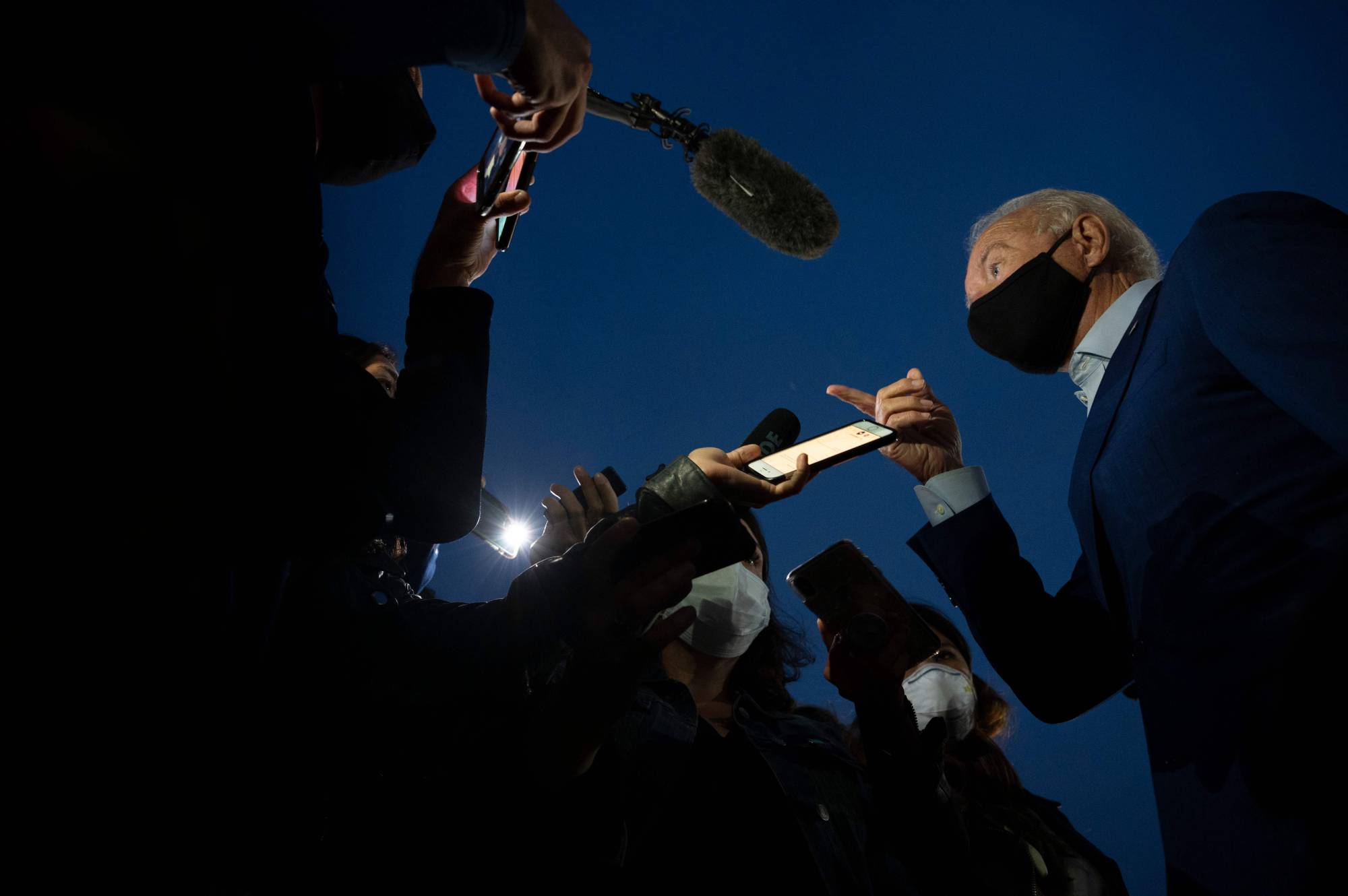 Democratic U.S. presidential candidate Joe Biden speaks with the media as he departs Detroit Metro Wayne County Airport in Romulus, Michigan, on Wednesday. | AFP-Jiji