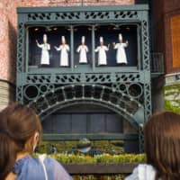 Visitors look at an outdoor display at Shiroi Koibito Park in Sapporo in August. | BLOOMBERG
