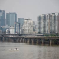 A man enjoys wakeboard at a Han River park in Seoul on Thursday. | REUTERS