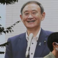 One thing Yoshihide Suga may have gained from his humble roots is sensitivity to the needs of the general public. | AP