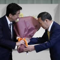 Yoshihide Suga has recalled how, as a junior politician, he was once impressed by Prime Minister Shinzo Abe’s views on the politically charged issue of Japanese citizens abducted by North Korean agents in the 1970s and 1980s. | AP