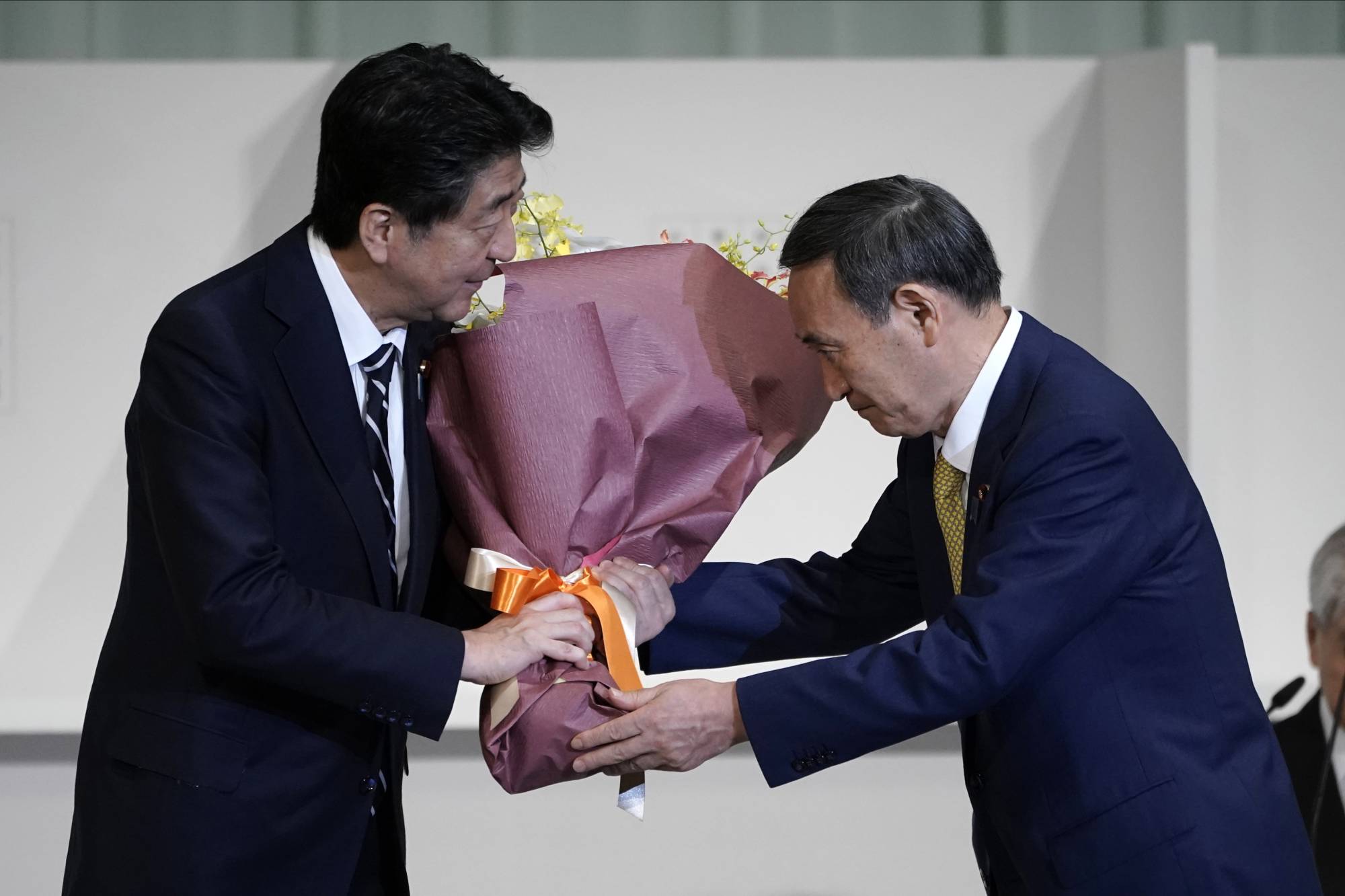 Yoshihide Suga has recalled how, as a junior politician, he was once impressed by Prime Minister Shinzo Abe’s views on the politically charged issue of Japanese citizens abducted by North Korean agents in the 1970s and 1980s. | AP
