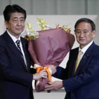 In a Sept. 11 National Security Council meeting, outgoing Prime Minster Shinzo Abe issued a statement that stated Tokyo is contemplating setting a new direction for the national security policy to cope with missiles targeting Japan. | POOL / VIA AP