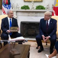 U.S. President Donald Trump and Israeli Prime Minister Benjamin Netanyahu meet in the Oval Office of the White House on Tuesday.  | DOUG MILLS / THE NEW YORK TIMES