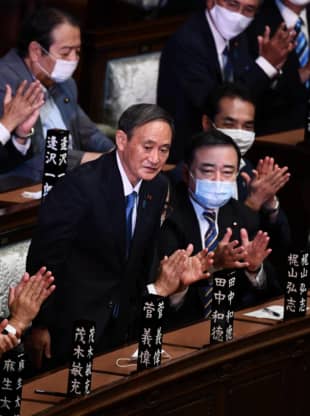 Yoshihide Suga reacts after he was elected prime minister by the Lower House on Wednesday. | AFP-JIJI
