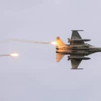 Taiwan\'s domestically built Indigenous Defense Fighters take part in a live-fire exercise that simulates an enemy invasion, in July. | REUTERS
