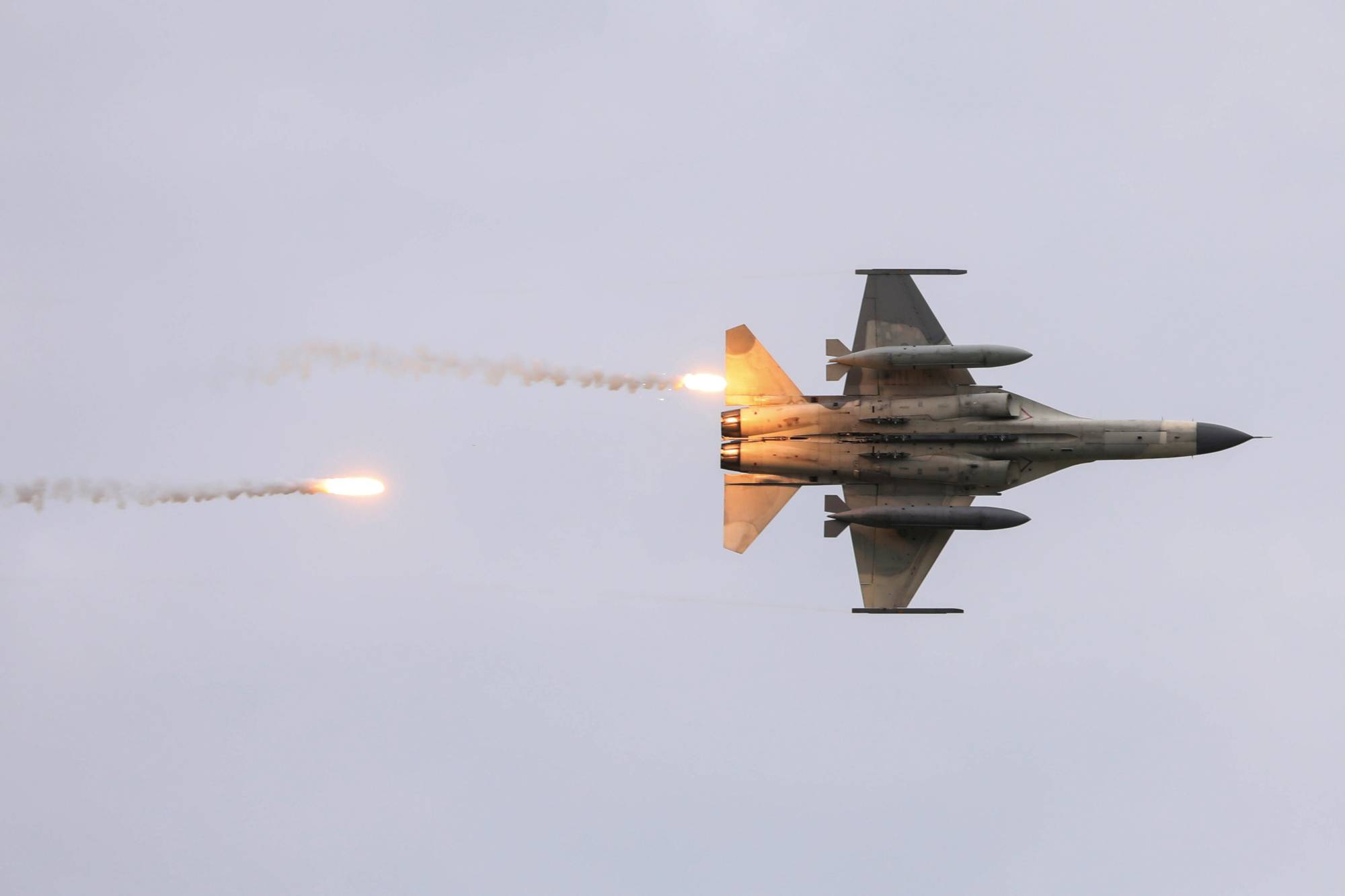 Taiwan's domestically built Indigenous Defense Fighters take part in a live-fire exercise that simulates an enemy invasion, in July. | REUTERS