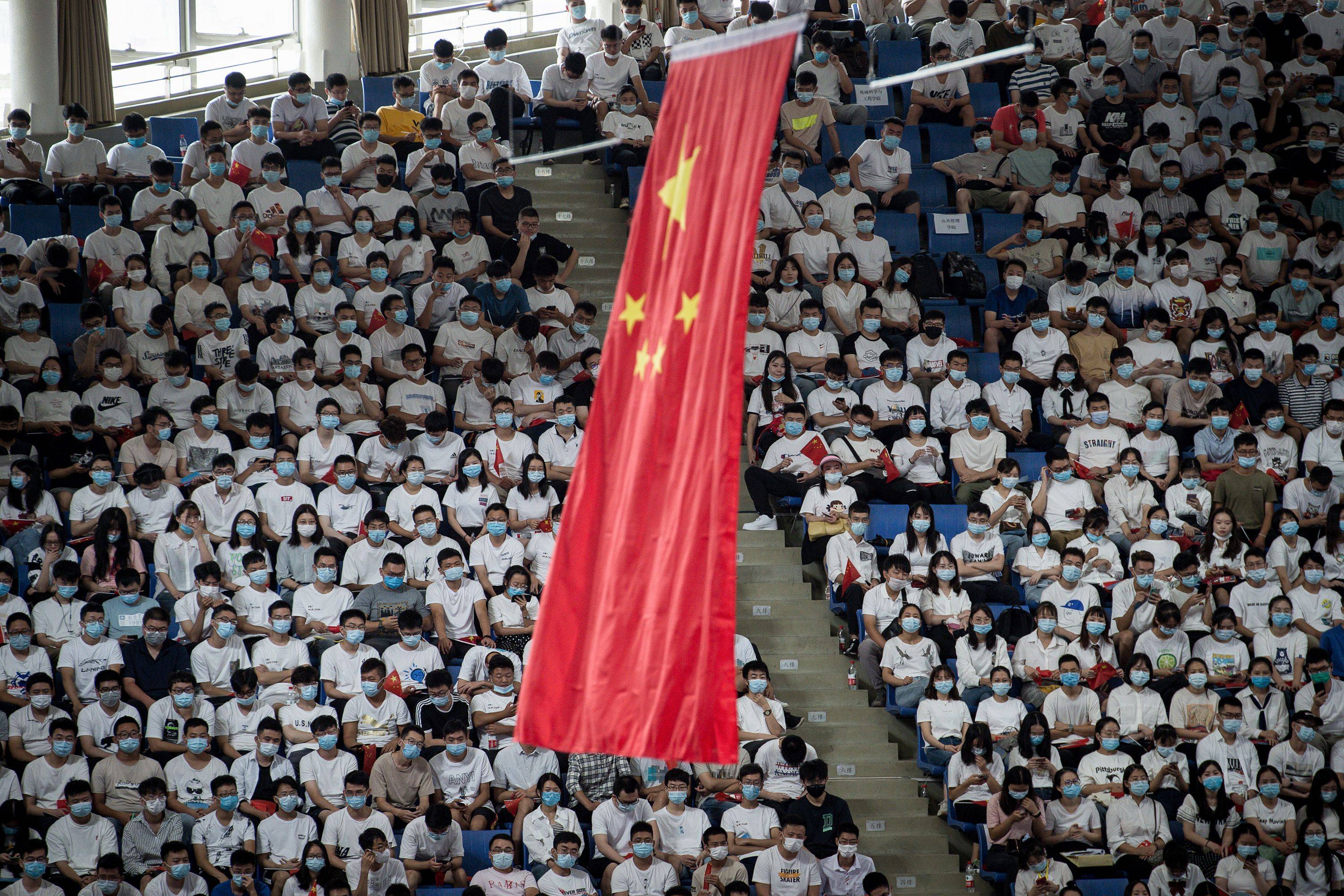 Chinese students at home and abroad have become the object of scrutiny over theft of intellectual property and harassment of academics. | STR / AFP-JIJI