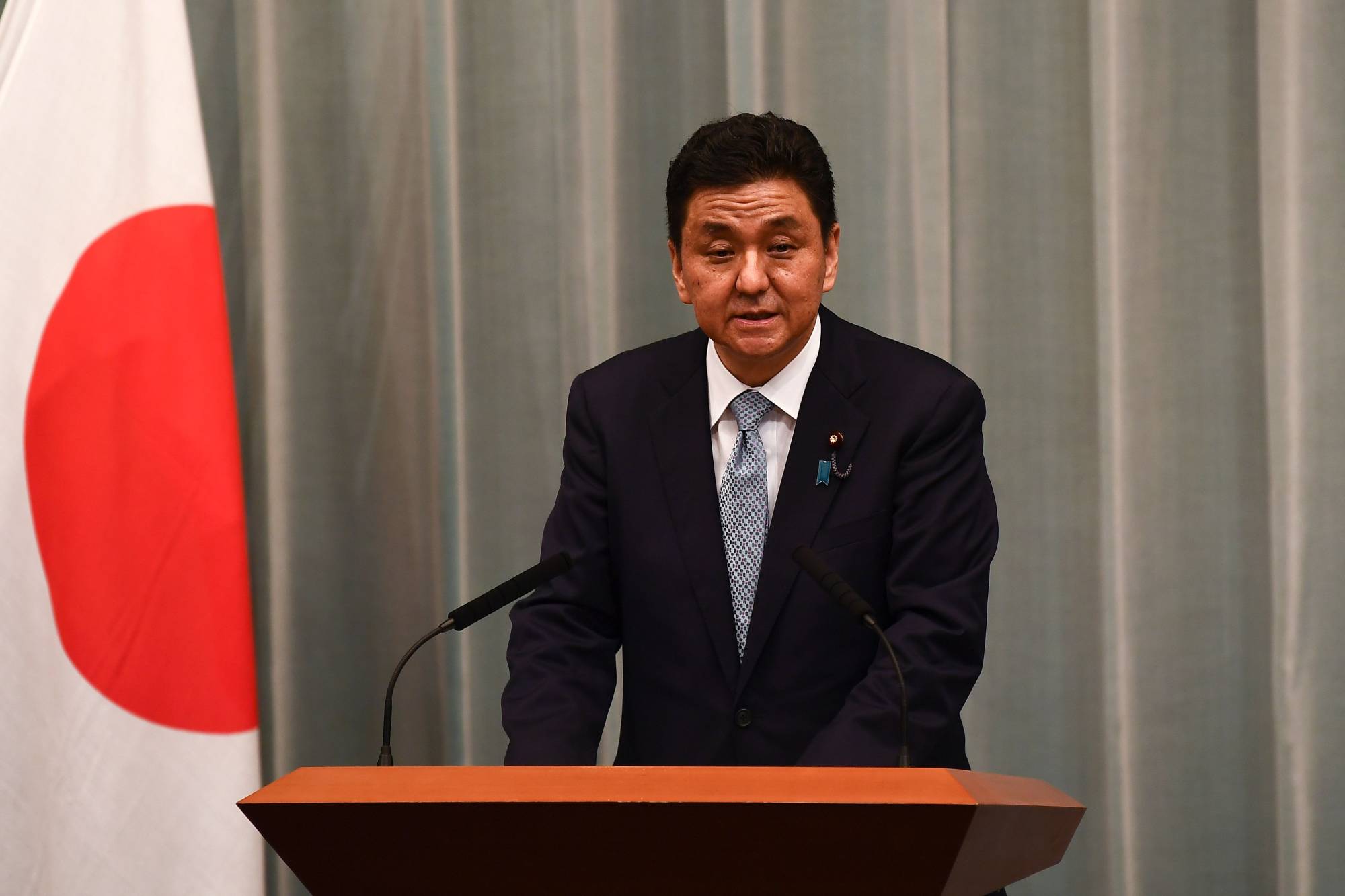 Newly apppinted Defense Minister Nobuo Kishi speaks at a news conference at the Prime Minister's Office in Tokyo on Wednesday. | AFP-JIJI 