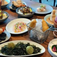 Fish feast: Due to coronavirus concerns, chef Shinsuke Ishii lays out all the dishes in front of you once you’re seated in a “table buffet.” | ROBBIE SWINNERTON
